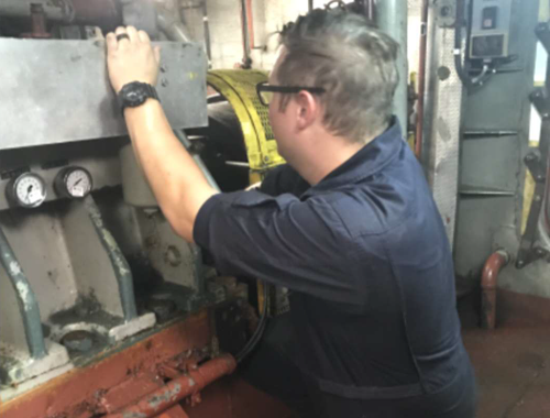 An engineer on DEPENDABLE conducts maintenance on the Reduction Gear. An engineer on DEPENDABLE conducts maintenance on the Reduction Gear.
